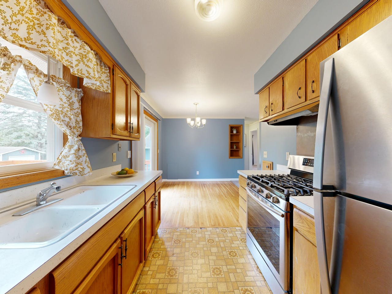 Home cozy-kitchen-with-wooden-cabinets-and-modern-stove-35505452